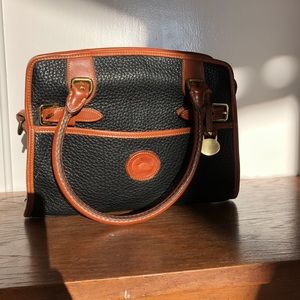 Dooney and Bourke black and brown leather purse.